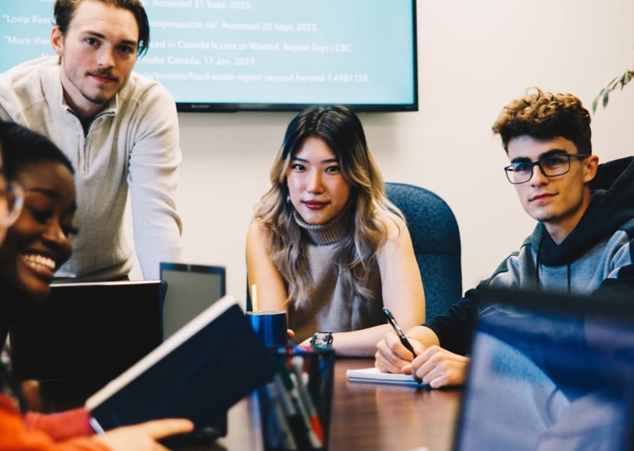 Students in a classroom working around a table