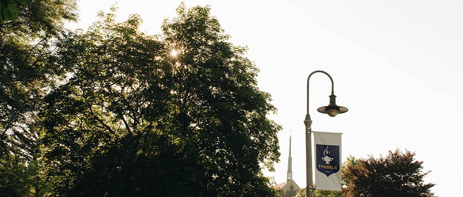 Tyndale campus with lampost Tyndale flag