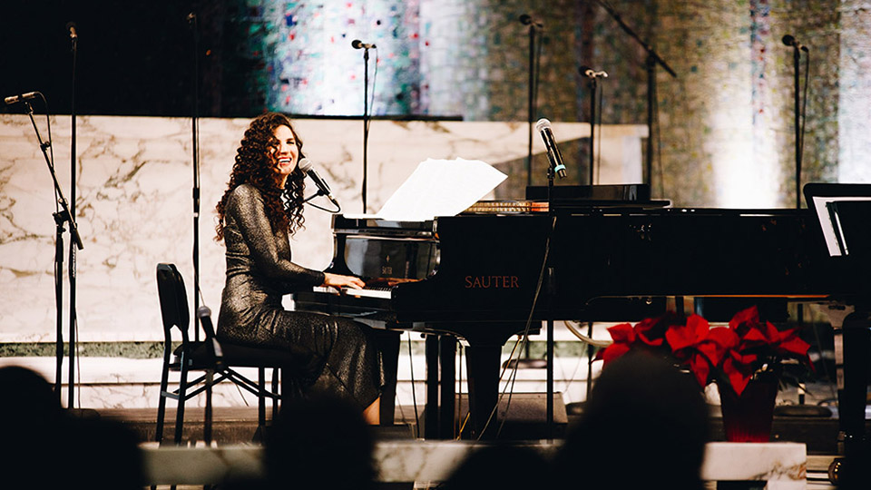 Laila Biali playing piano on stage