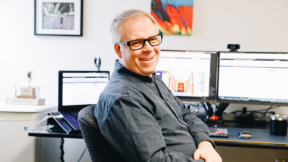 Andy Smith sitting at his desk