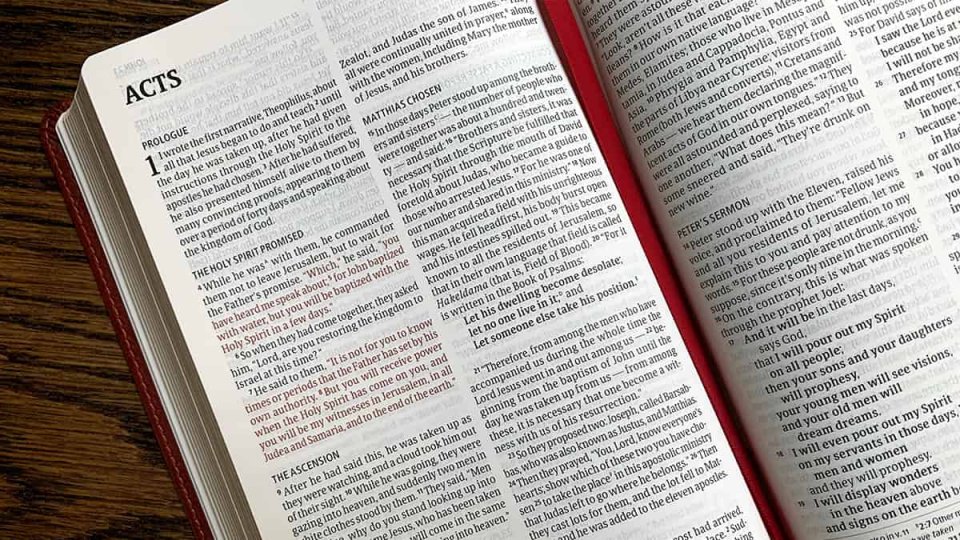 A Bible open to Acts 1