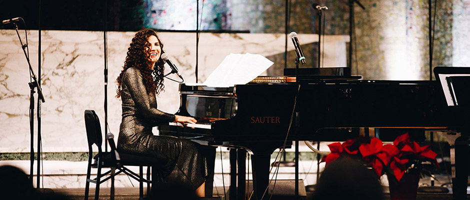 Laila Biali playing piano on stage