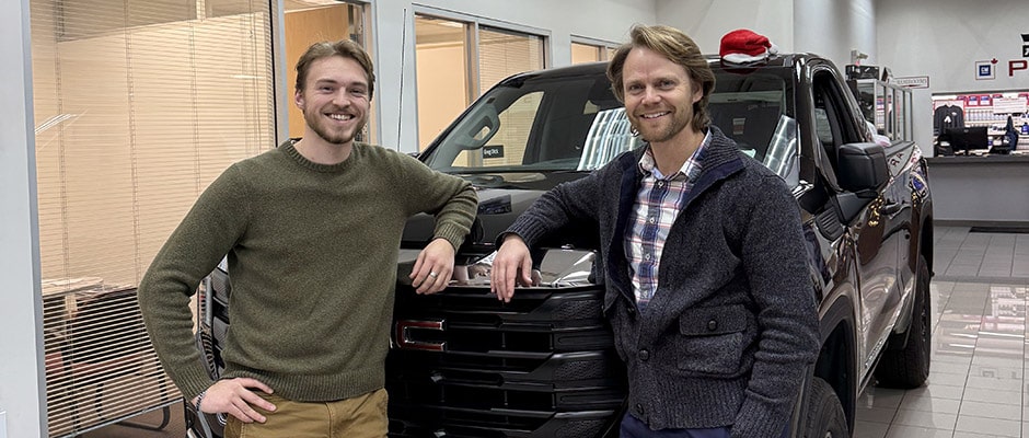 Matthew Habinski standing in front of a pickup