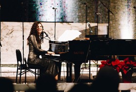 Laila Biali playing piano on stage