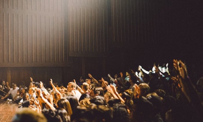 students raising hands