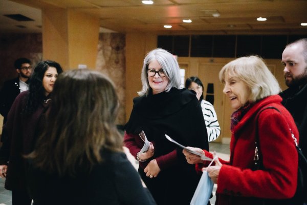 Attendees chatting and entering the Tyndale Chapel for the Christmas in Chapel Event