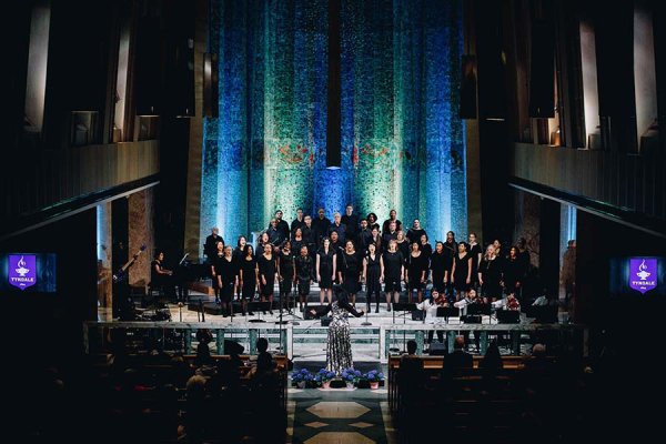 Tyndale Community Choir (TCC), TCC Band, local recording artist Saj McKenley, and other guest performers at centre stage