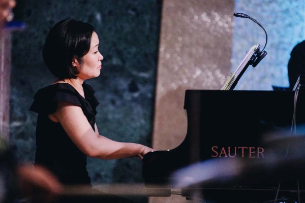 Pianist, Dr. Joy Lee plays the piano