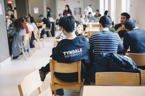 People enjoying a meal in the Tyndale dinning room