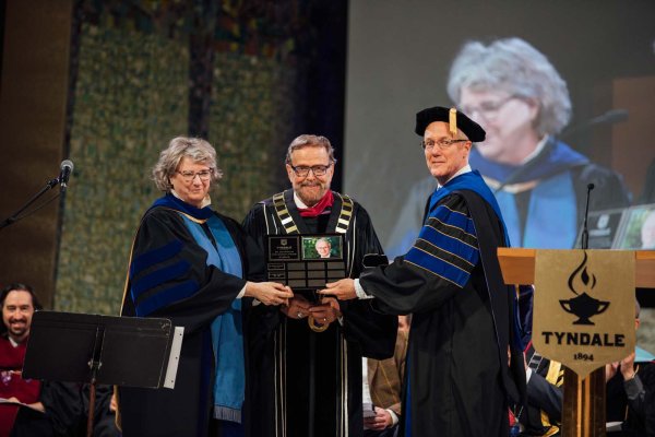 Barry Smith presenting award to Carla Nelson and Rick Cunningham 