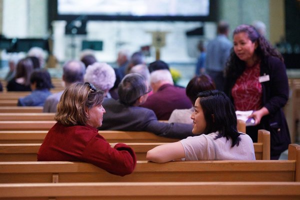 Alumni sitting in chapel