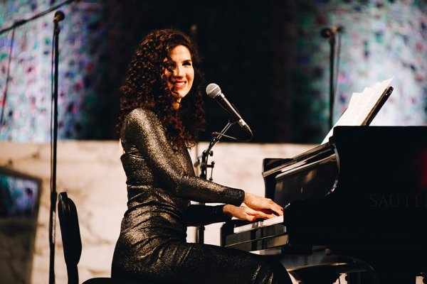 Laila Biali playing piano on stage