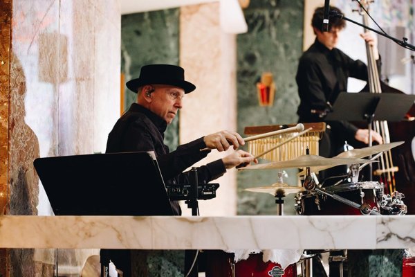 Man from choir band playing drums