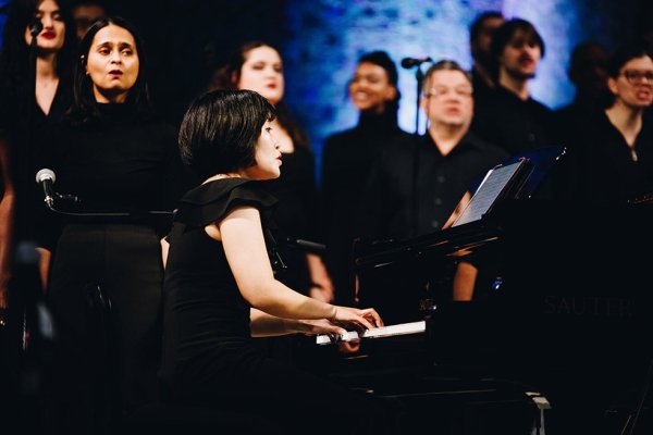 Tyndale Community Choir playing piano and singing